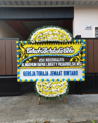 Papan Bunga Duka di Tomuan